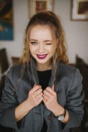 Happy woman winking at the camera