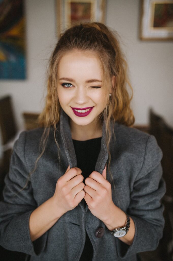 Happy woman winking at the camera