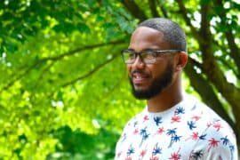Man outside wearing glasses