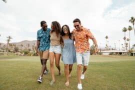Happy people walking together outside